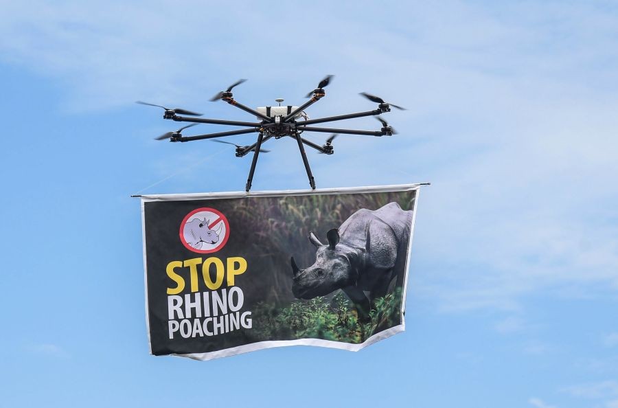 Golaghat: A drone carries a banner with a message "STOP RHINO POACHING", on the eve of World Rhinoceros Day, at Bokaghat in Golaghat district, Tuesday, Sept. 21, 2021. (PTI Photo)