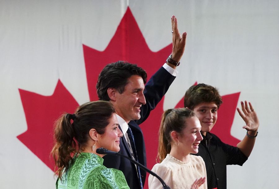 Montreal  : Prime Minister Justin Trudeau is joined on stage by wife Sophie Gregoire Trudeau, left, and children Xavier and Ella-Grace, during his victory speech at Party campaign headquarters in Montreal, early Tuesday, Sept. 21, 2021.   AP/PTI