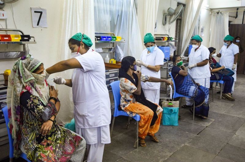 Women beneficiaries receive Covid-19 vaccine during a special vaccination drive for women in Mumbai on September 27. (PTI Photo)