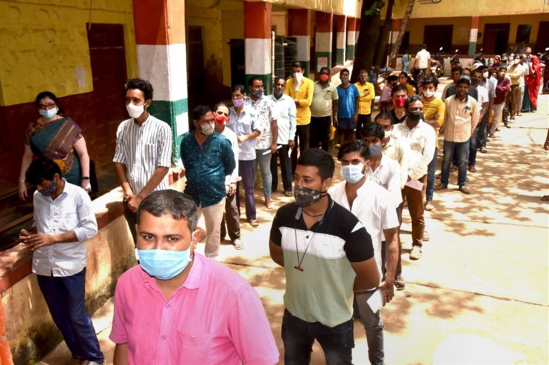 Beneficiaries wait in queues to receive COVID-19 vaccine dose, in Hubballi on September 17, 2021. (PTI Photo)