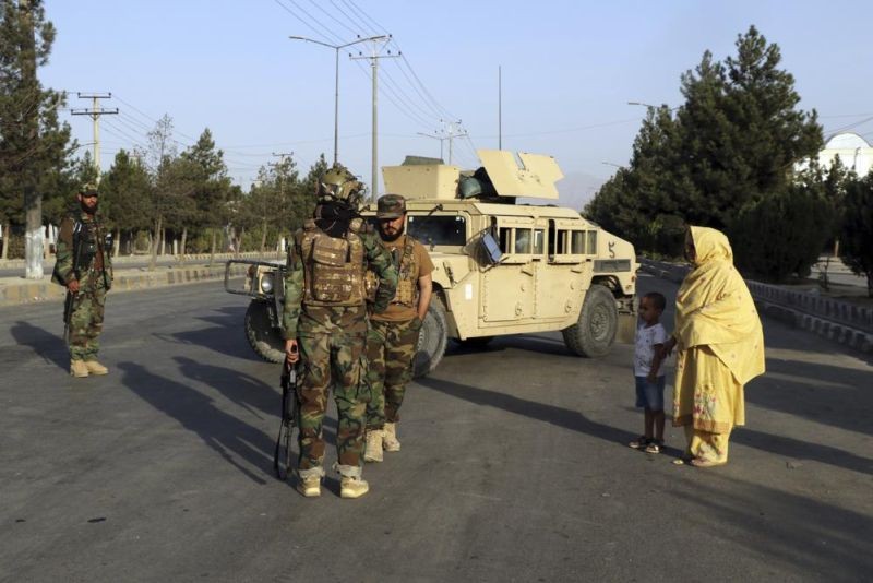 Taliban fighters stand guard at a checkpoint near the gate of Hamid Karzai international Airport in Kabul, Afghanistan, Saturday, Aug. 28, 2021. The Taliban have sealed off Kabul’s airport to most would-be evacuees to prevent large crowds from gathering after this week's deadly suicide attack. The massive U.S.-led airlift was winding down Saturday ahead of a U.S. deadline to withdraw from Afghanistan by Tuesday. (AP Photo)