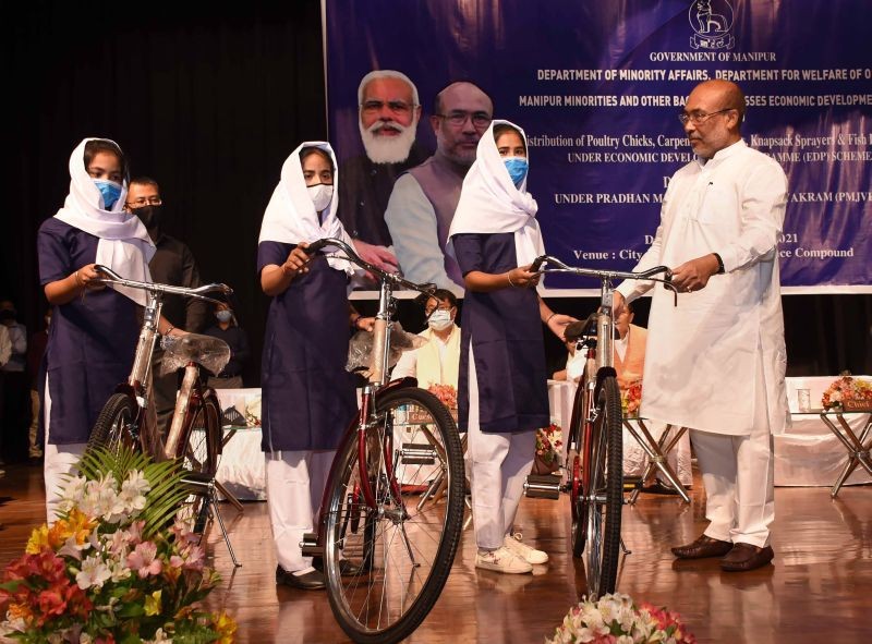 Imphal: Manipur CM N. Biren Singh distributes bicycles to students under the Pradhan Mantri Jan Vikas Karyakaram (PMJVK) Scheme at City Convention Centre in Imphal, Saturday, Sept. 18, 2021. (PTI Photo)