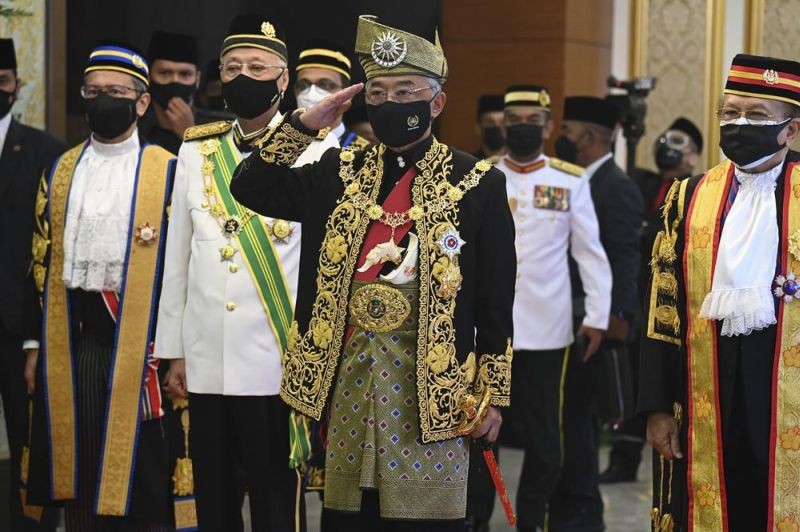 n this photo released by Malaysia's Department of Information, Malaysia's King Sultan Abdullah Sultan Ahmad Shah, center, salutes as he and Prime Minister Ismail Sabri Yaakob, center left, inspect an honor guard before the opening ceremony of the parliamentary session at the parliament house in Kuala Lumpur, Malaysia on September 13, 2021. Barely a month in office, Malaysia's new leader, Ismail, has won opposition support to shore up his fragile government in exchange for a slew of reforms as Parliament reopened Monday. (AP Photo)