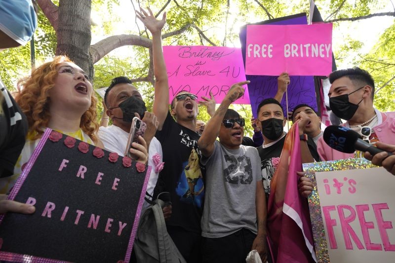 Britney Spears supporters celebrate outside the Stanley Mosk Courthouse on September 29, 2021, in Los Angeles. A judge on Wednesday suspended Britney Spears' father from the conservatorship that has controlled the singer's life and money for 13 years, saying the arrangement "reflects a toxic environment." (AP/PTI Phoro)