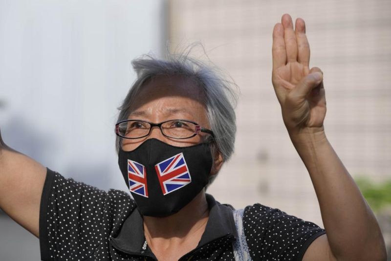 A supporter of the Hong Kong Alliance in Support of Patriotic Democratic Movements of China protests outside a court, in Hong Kong on September 10. Hong Kong police charged the group that organizes the city's annual Tiananmen candlelight vigil and three of its leaders with subversion under the national security law, amid an ongoing crackdown on dissent. (AP Photo)