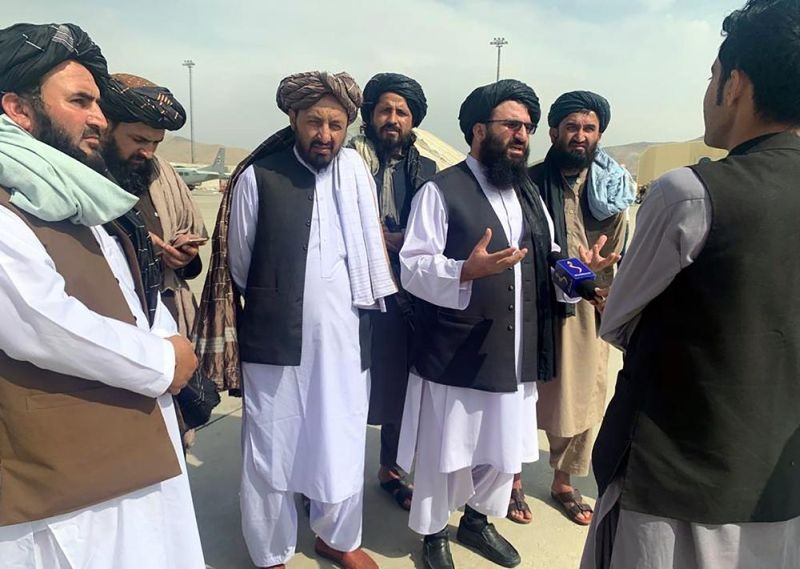 aliban officials are interviewed by journalists inside the Hamid Karzai International Airport after the U.S. withdrawal in Kabul, Afghanistan on August 31, 2021.  (AP File Photo)