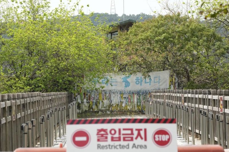 A banner and ribbons wishing reunification of the two Koreas are displayed on the wire fence at the Imjingak Pavilion in Paju, near the border with North Korea, South Korea on September 24, 2021. North Korean leader Kim Jong Un’s powerful sister, Kim Yo Jong, said Friday, North Korea is willing to resume talks with South Korea if it doesn’t provoke the North with hostile policies and double standards.The banner reads: "We Are One". (AP Photo)