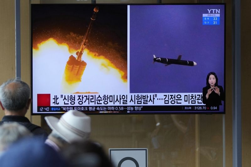 People watch a TV screen showing a news program reporting about North Korea's long-range cruise missiles tests with images in Seoul, South Korea on September 13, 2021. North Korea says it successfully test fired newly developed long-range cruise missiles over the weekend, its first known testing activity in months, underscoring how it continues to expand its military capabilities amid a stalemate in nuclear negotiations with the United States. The letters read, "The North newly test-fired long-range cruise missiles. "  (AP/PTI Photo)