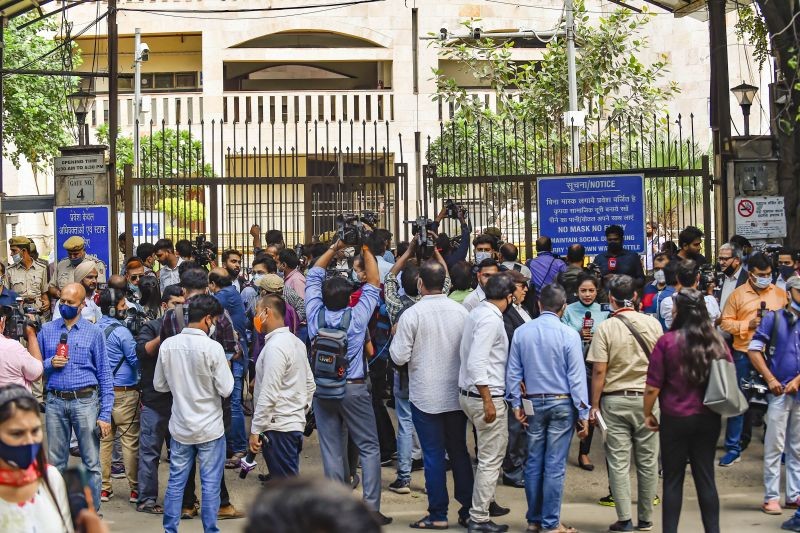 Media personnel and others following a shootout at the Rohini Court, where gangster Jitender Gogi was being produced, in New Delhi, Friday, Sept. 24, 2021. (PTI Photo)