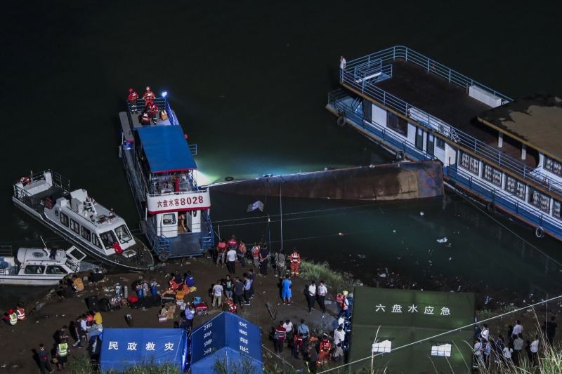 In this photo released by Xinhua News Agency, rescuers conduct search and rescue at the site of an overturned passenger ship in Liupanshui in southwest China's Guizhou province on September 19, 2021. The boat has left multiple people dead, with several others still missing, according to state media on Sunday. CCTV said that the ship overturned shortly after it departed Saturday evening. Preliminary investigations suggest that the ship was blown over by strong winds. (AP/PTI Photo)