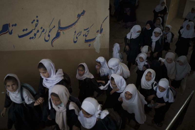 Girls walk upstairs as they enter a school before class in Kabul, Afghanistan on September 12, 2021. (AP/PTI Photo)