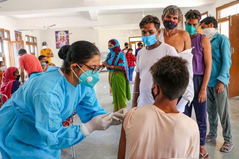 A labourer receives a dose of COVID-19 vaccine in the outskirts of Jammu on September 13. (PTI Photo)