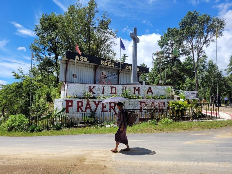 A farmer walks past Kidima Prayer Park in southern Angami area of Kohima district. (Morung Photo by Chizokho Vero)