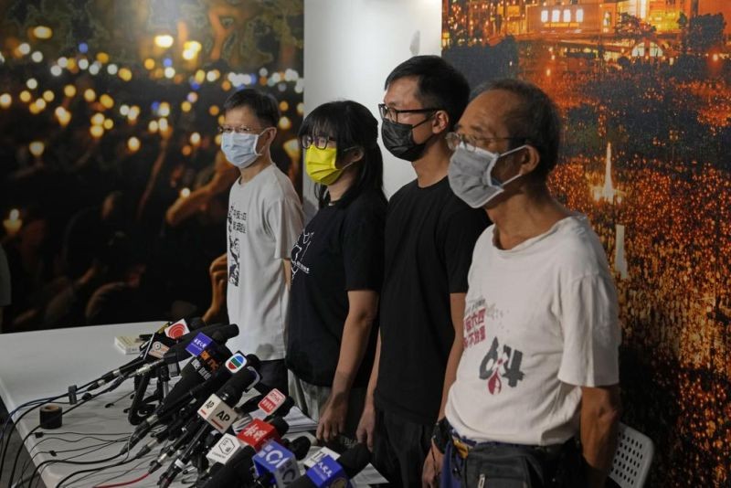 In this Sunday, Sept. 5, 2021, file photo, Chow Hang-tung, second from left, vice chairwoman of the Hong Kong Alliance in Support of Patriotic Democratic Movements of China, and other group members attend a news conference in Hong Kong. Four leaders of the Hong Kong activist group, including Chow, have been arrested after defying a police request to cooperate in a national security investigation, the group said Wednesday, September 8, 2021. (AP Photo)