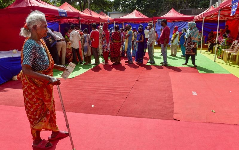 Beneficiaries wait in queues to receive COVID-19 vaccine dose, at Bharat Scouts and Guide headquarters, in New Delhi on September 29, 2021. (PTI Photo)