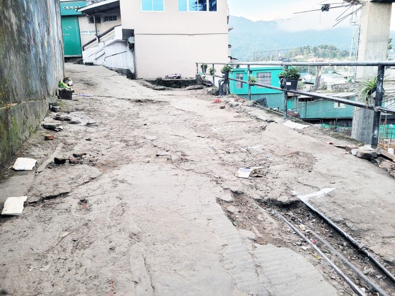 A portion of pavement in need of repairs behind Khuochiezie (Kohima Local Ground) in Kohima. (Morung Photo by Chizokho Vero)