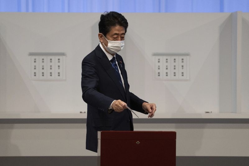 Japan's former Prime Minister Shinzo Abe casts his vote in the Liberal Democrat Party leadership election in Tokyo Wednesday, Sept. 29, 2021. Japan's former Foreign Minister Fumio Kishida won the governing party leadership election on Wednesday and is set to become the next prime minister, facing the imminent task of addressing a pandemic-hit economy and ensuring a strong alliance with Washington to counter growing regional security risks. (AP/PTI Photo)