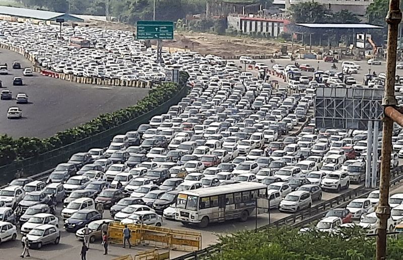 Massive traffic jam on Delhi- Gurugram expressway at Gurugram- Delhi border due to barricading by Delhi Police, in the view of 'Bharat Bandh' called by farmers organization, near Sirhaul Toll Plaza in Gurugram on September 27, 2021. (PTI Photo)