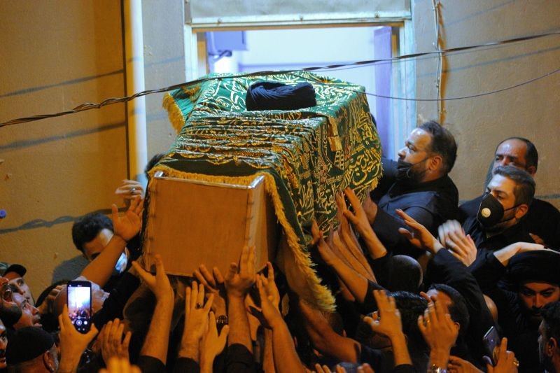 Mourners escort the coffin of Grand Ayatollah Sayyid Mohammed Saeed al-Hakim to his home in Najaf, Iraq on September 3, 2021. Mohammed Saeed al-Hakim, one of Iraq's most senior and influential Muslim Shiite clerics, has died, members of his family said. He was 85. (AP/PTI Photo)