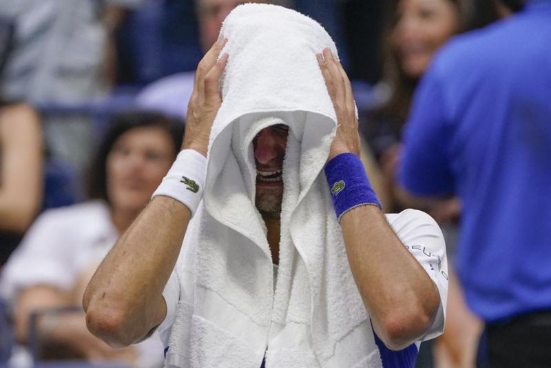 Novak Djokovic, of Serbia, cries as he sits on his bench during a changeover in the third set of the men's singles final against Daniil Medvedev, of Russia, of the US Open tennis championships on September 12, 2021, in New York. (AP Photo)