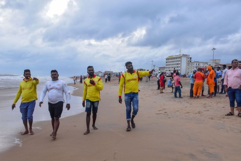 Lifeguard alert visitors not to venture out in the sea in view of Cyclone 'Gulab' in Puri on September 26, 2021. (PTI Photo)