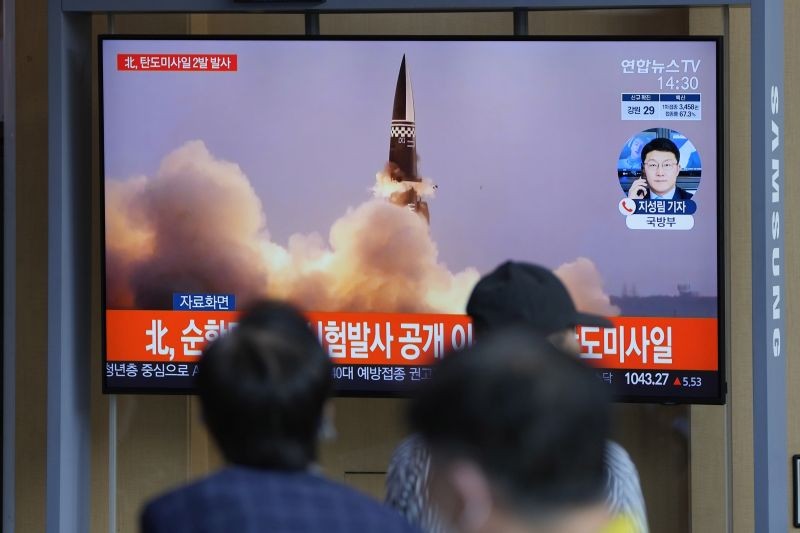People watch a TV screen showing a news program reporting about North Korea's missiles with file image, in Seoul, South Korea on September 15, 2021. North Korea fired two ballistic missiles into waters off its eastern coast Wednesday afternoon, two days after claiming to have tested a newly developed missile in a resumption of its weapons displays after a six-month lull. (AP/PTI Photo)