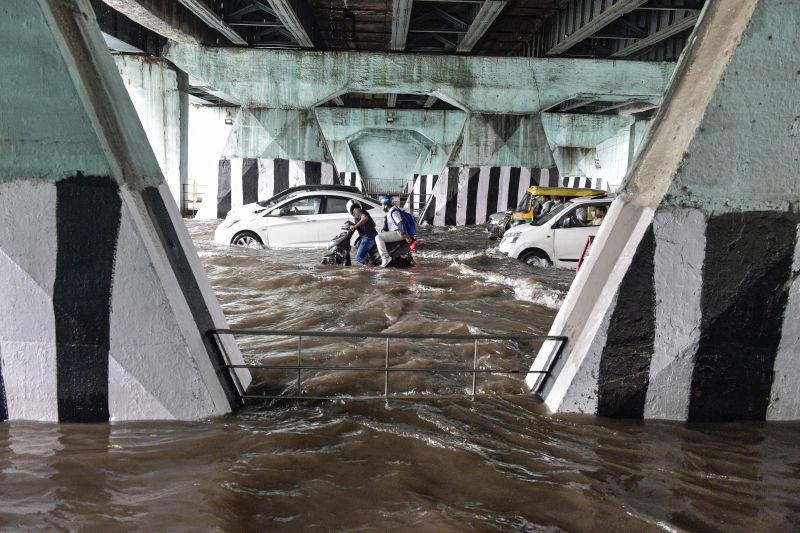 New Delhi: Vehicles ply on the waterlogged Bahadur Shah Zafar Marg after heavy rain at ITO in New Delhi, Wednesday, Sep. 1, 2021. (PTI Photo/Vijay Verma)
