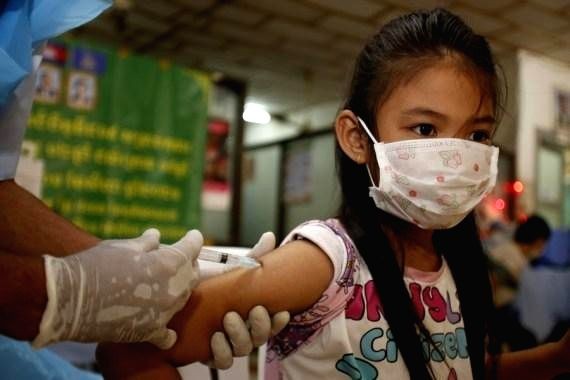A girl receives a dose of COVID-19 vaccine at an inoculation site in Phnom Penh, Cambodia on Sept. 17, 2021. (IANS  Photo)