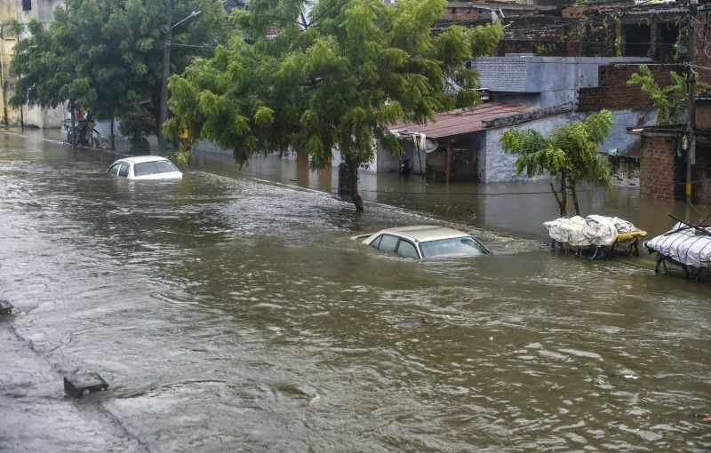 Lucknow: Partially submerged vehicles due to waterlogging following heavy rains in Lucknow, Thursday, Sept. 16, 2021. (PTI Photo/Nand Kumar)