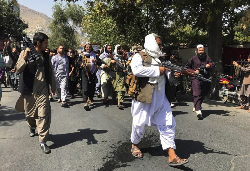 Taliban soldiers walk towards Afghans shouting slogans, during an anti-Pakistan demonstration, near the Pakistan embassy in Kabul, Afghanistan on September 7. (AP/PTI Photo)