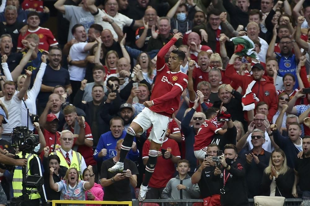 Manchester United's Cristiano Ronaldo celebrates after scoring his side's second goal during the English Premier League soccer match between Manchester United and Newcastle United at Old Trafford stadium in Manchester, on September 11. (AP Photo)