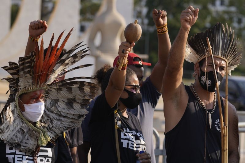 Brasilia : Indigenous people react after the Supreme Court judges' decision to suspend the vote that defines the demarcation of indigenous lands, during a protest in front of the Supreme Court building, in Brasilia, Brazil, Wednesday, Sept. 15, 2021. AP/PTI