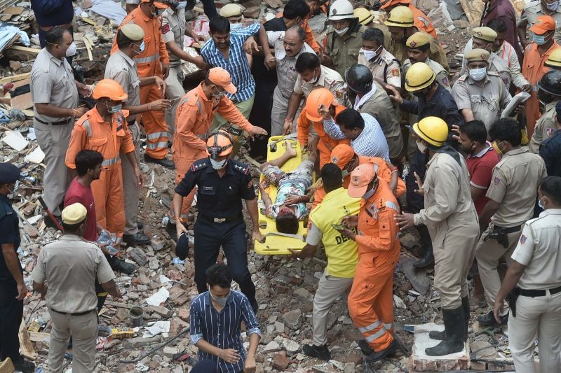 NDRF and police personnel during a rescue operation after a building collapsed at Sabji Mandi area in New Delhi on September 13. (PTI Photo)