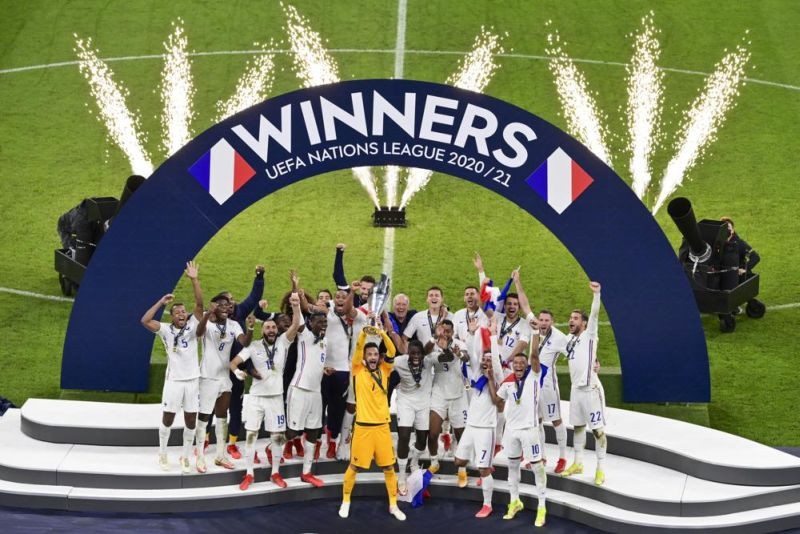 French players react with their trophy after defeating Spain to win the UEFA Nations League final soccer match at the San Siro stadium, in Milan, Italy on   October 10, 2021. (AP Photo)