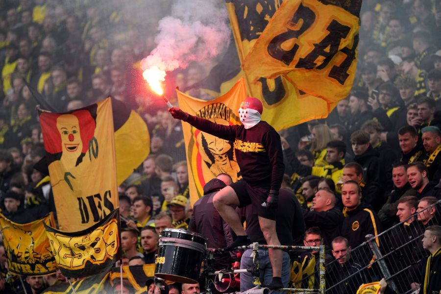 Dortmund: A Dortmund fan holds a flare before the German Bundesliga soccer match between Borussia Dortmund and 1.FC Cologne in Dortmund, Germany, Saturday, Oct. 30, 2021. AP/PTI