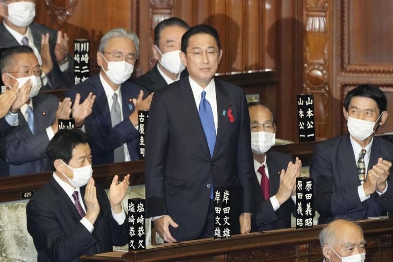 Fumio Kishida, center, is applauded after being named as Japan's prime minister at the parliament's lower house in Tokyo on October 4, 2021. Kishida was elected Japan's prime minister in a parliamentary vote Monday and will be tasked with quickly tackling the pandemic and other domestic and global challenges and leading a national election within weeks. (AP Photo)