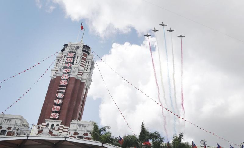 Thunder Tiger Aerobatics Team fly over President Office during National Day celebrations in Taipei, Taiwan on October 10, 2021. (AP Photo)