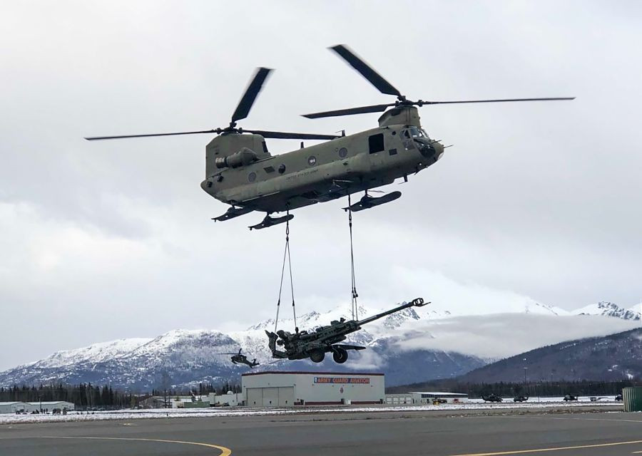 *EDS: TWITTER IMAGE POSTED BY @adgpi ON WEDNESDAY, OCT. 20, 2021.**Alaska: Indian Army and the US Army troops carry out joint training on medical evacuation and underslung carriage of howitzers with help of helicopters during the ongoing 17th Edition of India-US Joint military exercise at Alaska. (PTI Photo)