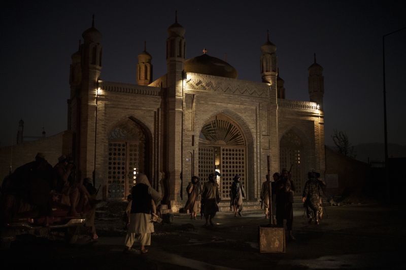 Taliban fighters walk at the entrance of the Eidgah Mosque after an explosion in Kabul, Afghanistan on October 3, 2021. (AP/PTI Photo)