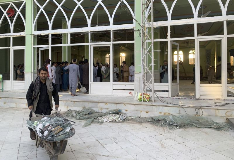 People view the damage inside of a mosque following a suicide bombers attack in the city of Kandahar, southwest Afghanistan, Friday, Oct. 15, 2021. Suicide bombers attacked a Shiite mosque in southern Afghanistan that was packed with worshippers attending Friday prayers, killing several people and wounding others, according to a hospital official and a witness.(AP/PTI Photo)