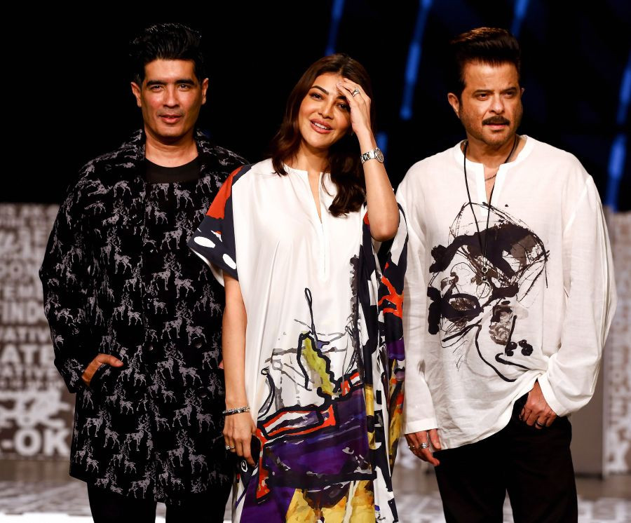 Mumbai:-Bollywood actress Kajal Aggarwal with Anil Kapoor and Manish Malhotra at designer Anamika Khanna show during the 'FDCI' Lakme Fashion Week  at Bandra Kurla Complex in Mumbai, Saturday, Oct. 9, 2021. (PTI Photo)