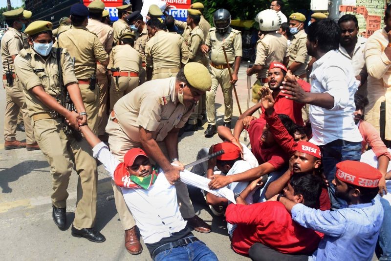 Policemen detain Samajwadi Party  members as they staged a protest over the Lakhimpur Kheri incident, in Prayagraj on October 4, 2021. (PTI Photo)