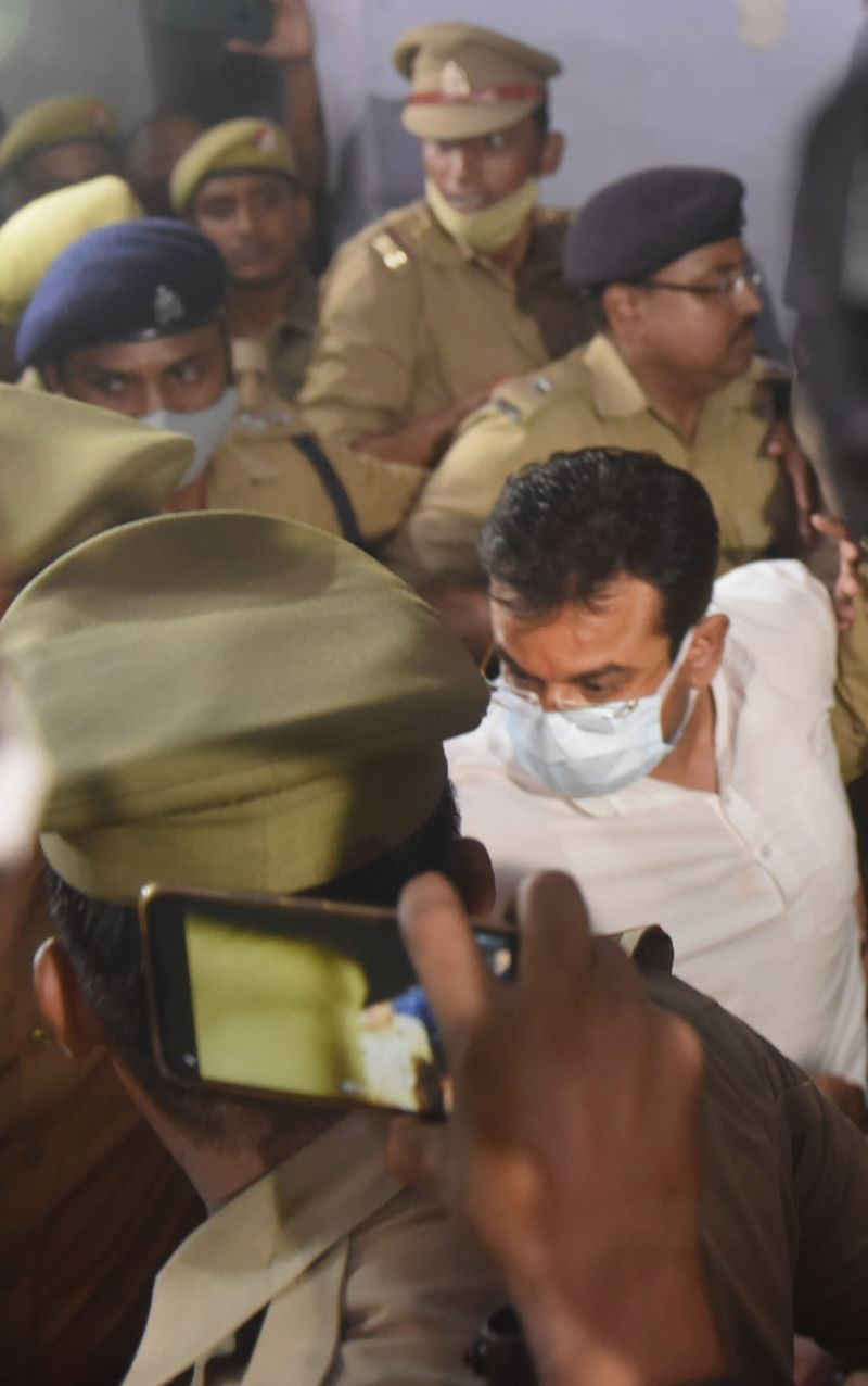 Union Minister of State for Home Ajay Misra's son Ashish Mishra being taken from crime branch office to be produced before magistrate, in Lakhimpur Kheri on October 9, 2021. (PTI Photo)