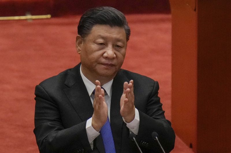 Chinese President Xi Jinping applauds during an event commemorating the 110th anniversary of Xinhai Revolution at the Great Hall of the People in Beijing on October 9, 2021. Xi said on Saturday reunification with Taiwan must happen and will happen peacefully, despite a ratcheting-up of China's threats to attack the island. (AP/PTI Photo)