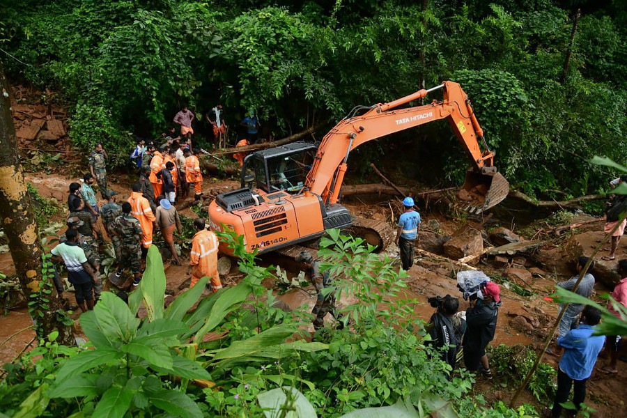Rapid Action Force (RAF) and Kerala Fire and Rescue personnel during rescue operations at the site of landslide at Kavali in Kottayam district on October 17. (PTI Photo)