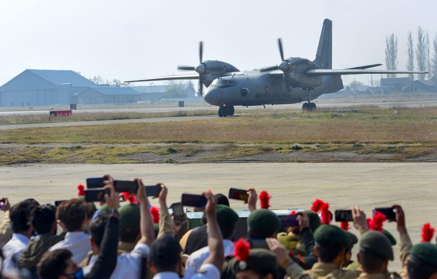 Srinagar: NCC cadets click pictures of an AN-32 aircraft during the re-enactment of incidents that took place when Pakistani invaders attacked Kashmir in 1947, in Srinagar, Wednesday, Oct. 27, 2021. Army is commemorating the 75th year of the air induction of Indian army to evict Pakistani forces from Kashmir on Oct 27, 1947. (PTI Photo/S. Irfan)