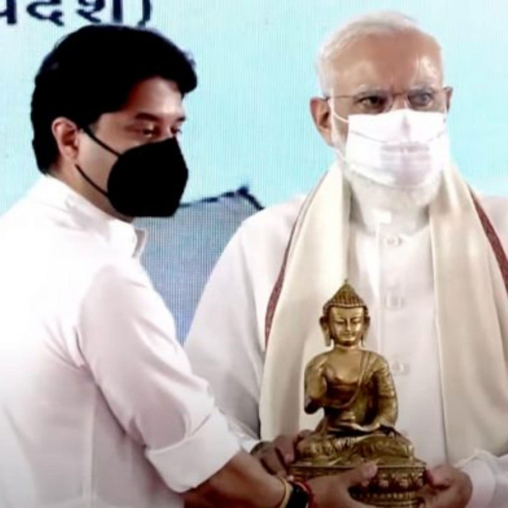 Civil aviation minister Jyotiraditya Scindia felicitates Prime Minister Narendra Modi at the inauguration of Kushinagar International Airport. (PTI Photo)