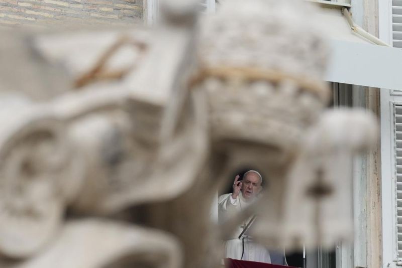 In this Sunday, Oct. 3, 2021 file photo, Pope Francis delivers his blessing during the Angelus noon prayer from the window of his studio overlooking St. Peter's Square, at the Vatican. Pope Francis and dozens of religious leaders on Monday, Oct. 4, 2021 signed a joint appeal to governments to commit to ambitious targets at the upcoming U.N. climate conference, while promising to do their own part to lead their faithful into more sustainable behavior. (AP File Photo)