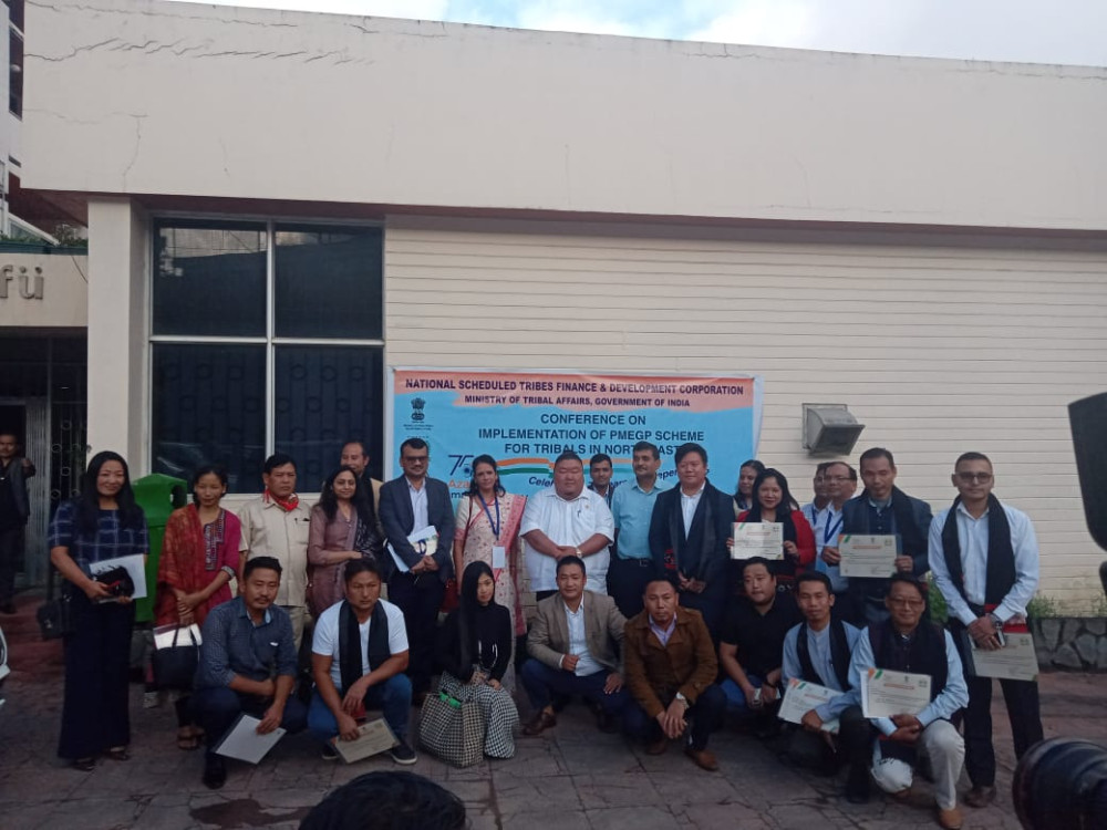 Temjen Imna Along and other officials with successful tribal entrepreneurs from North East in Kohima on October 21.