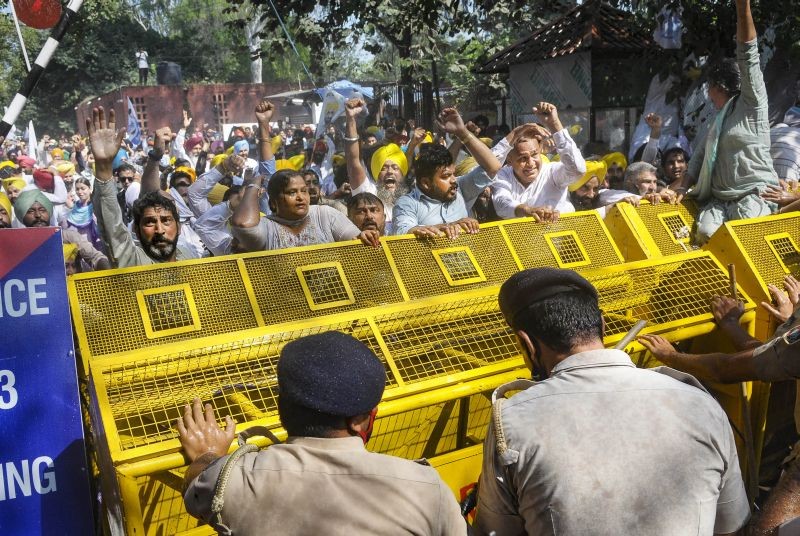 Police stop Aam Aadmi Party supporters who were staging a protest over Lakhimpur Kheri violence, outside the Raj Bhawan in Chandigarh on October 6, 2021. (PTI Photo)